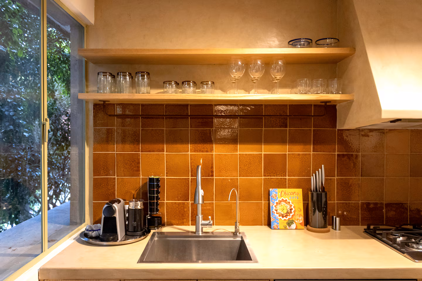 Kitchen counter with terracotta tiles and espresso machine