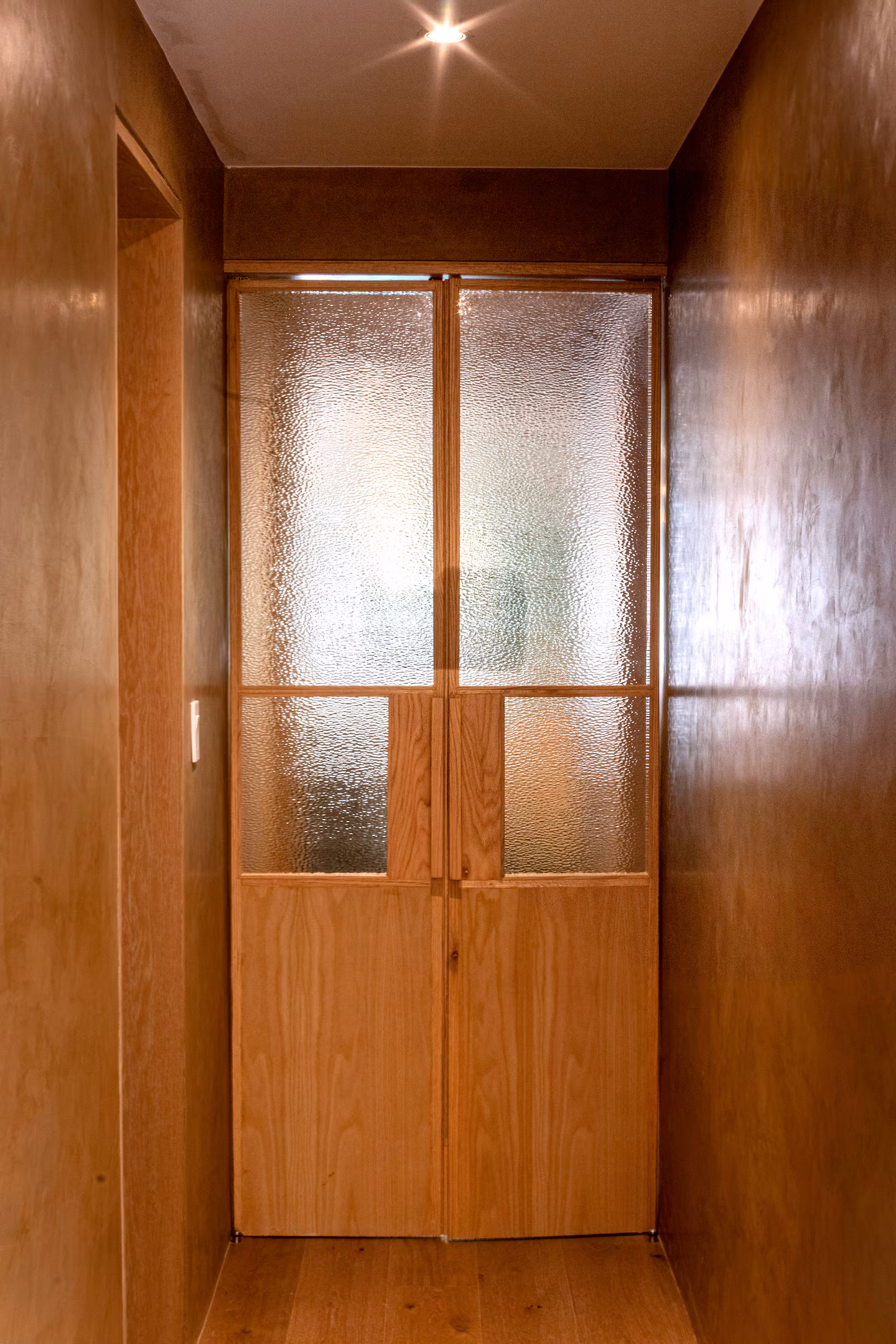 Entry with glass panel wooden doors